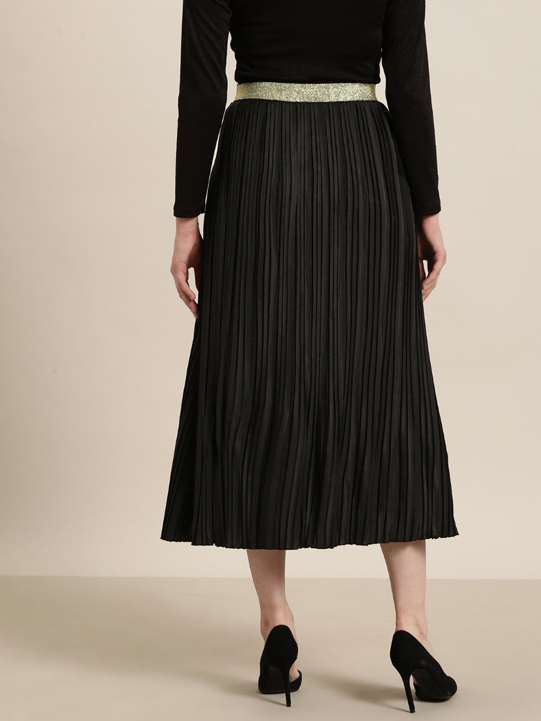 Black long pleated party skirt with a glittery elastic waistband