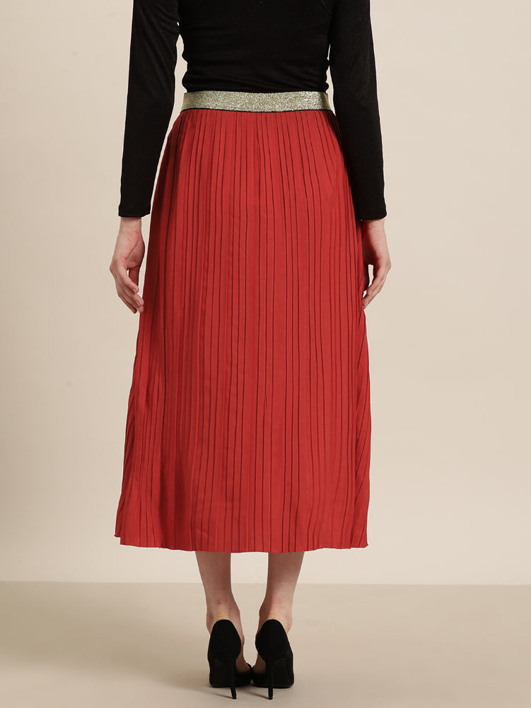 Red long pleated party skirt with a glittery elastic waistband
