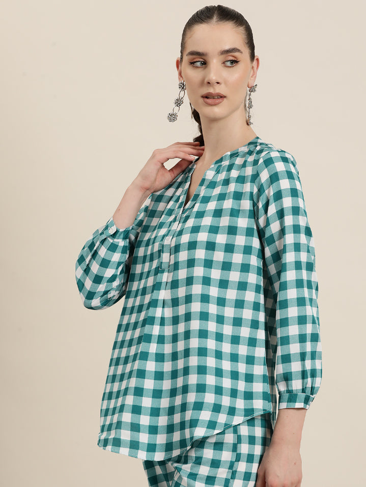 Teal and White plaid half placket shirt with full cuff sleeves.