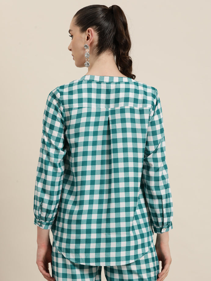 Teal and White plaid half placket shirt with full cuff sleeves.