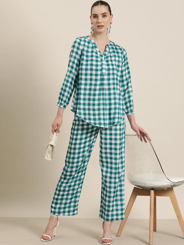 Teal and White plaid half placket shirt with full cuff sleeves.