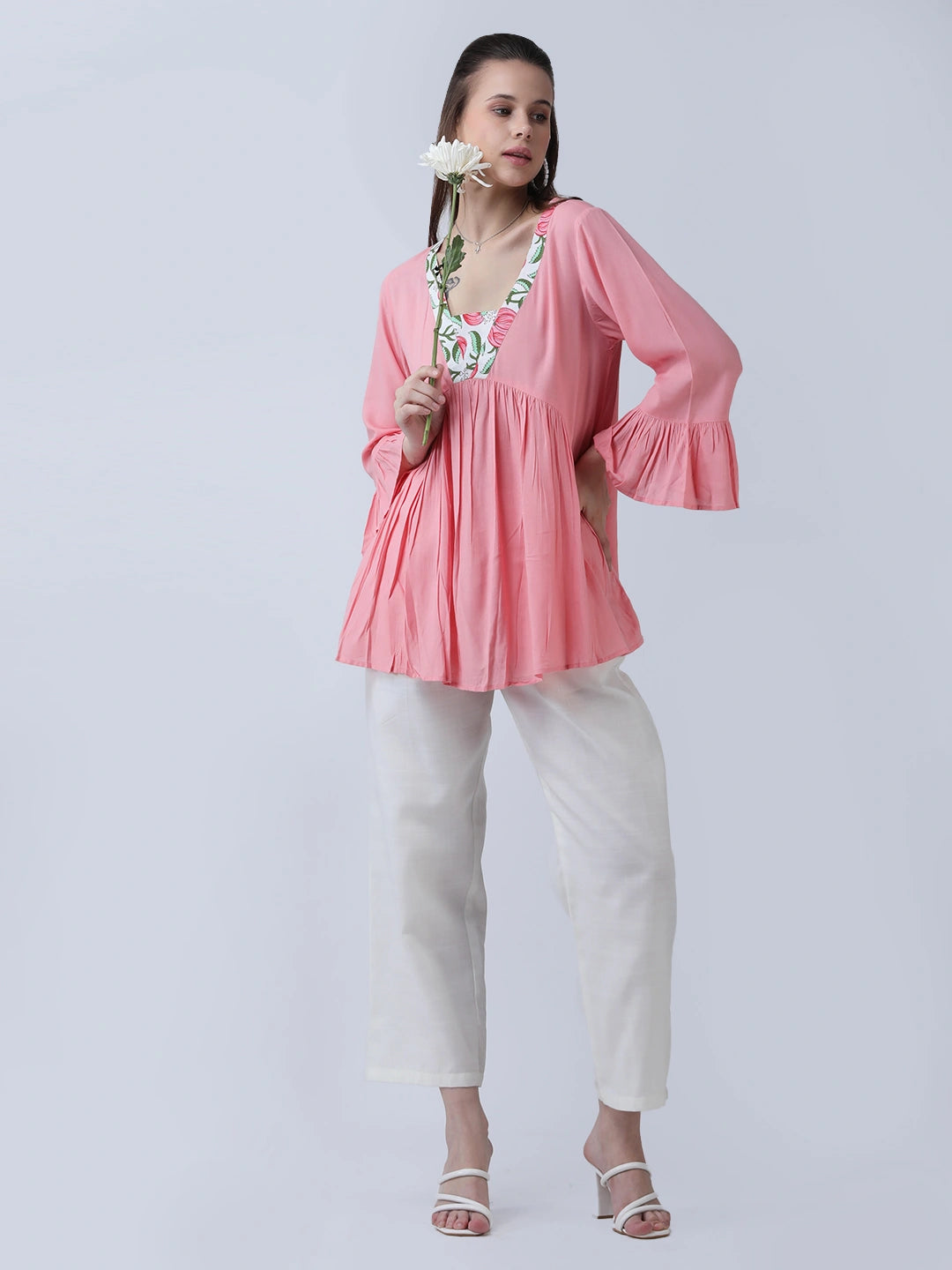 Peplum rayon top with printed neckline