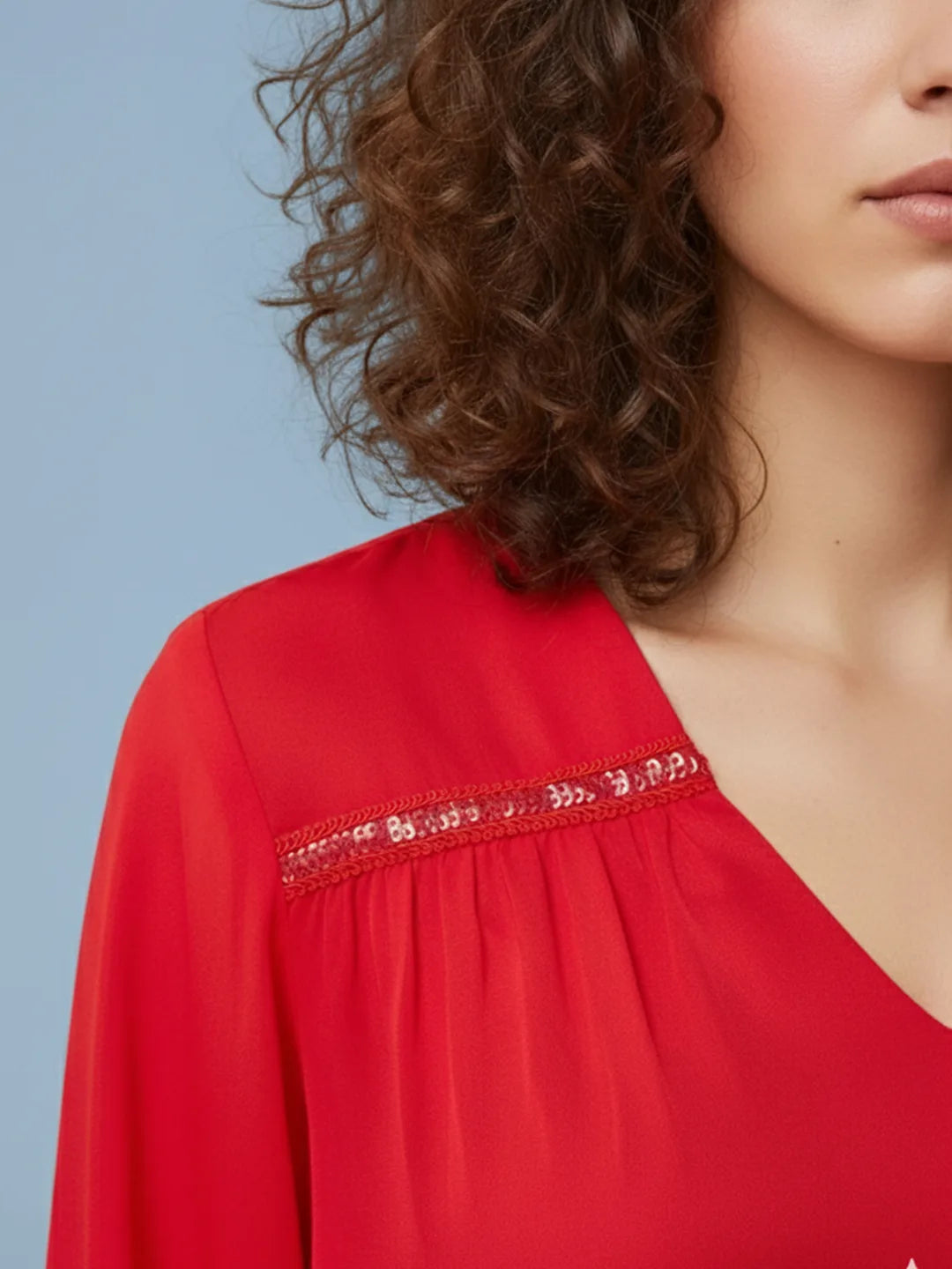 Red silk blend top with lace embellishment