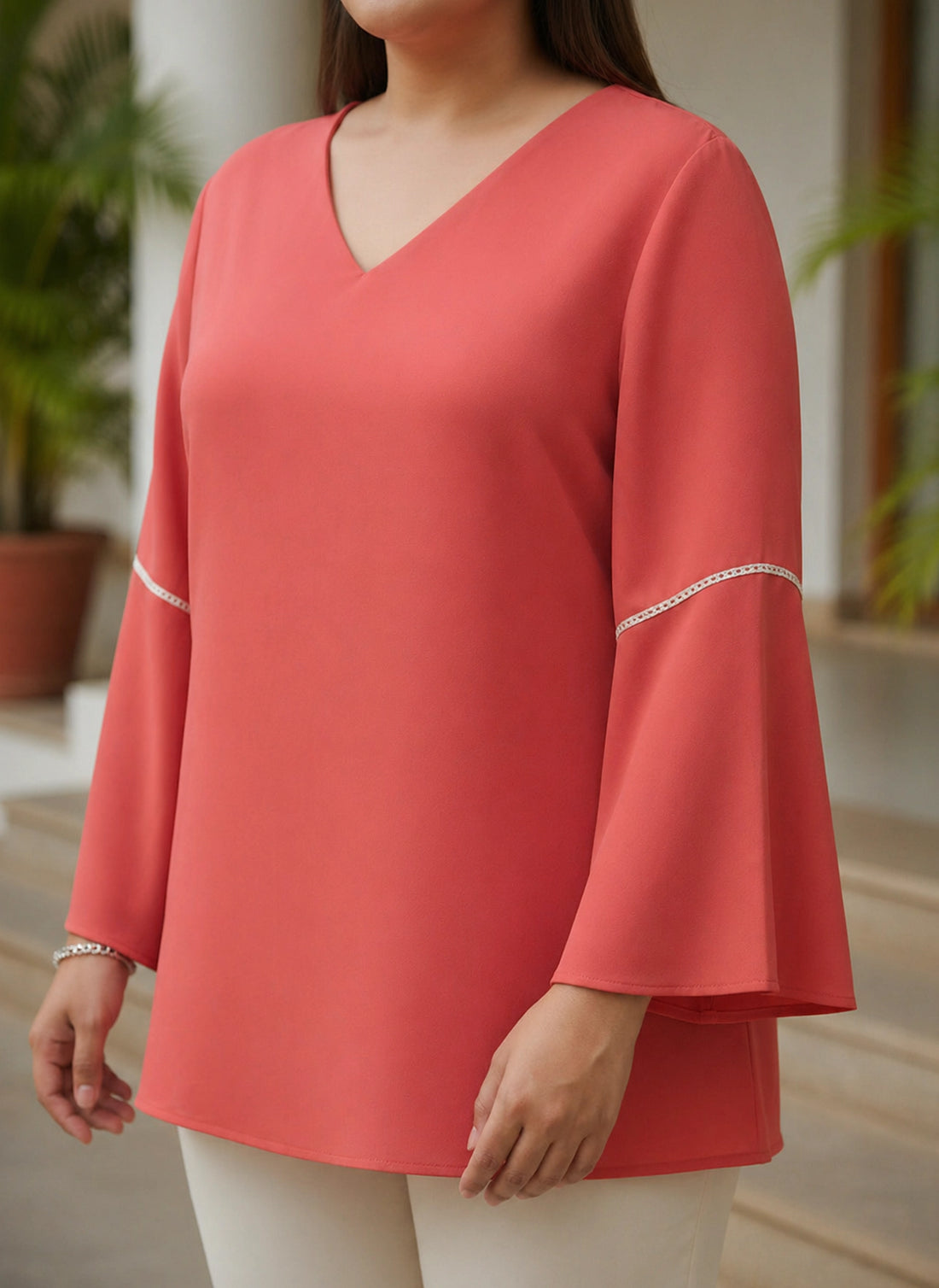 Fucia V-neck top with bell sleeves