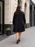 black moss crepe dress — close-up detail
