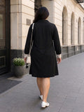 black moss crepe dress — close-up detail