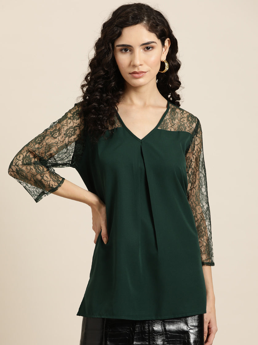 Emerald green crepe top with floral net sleeves and yoke