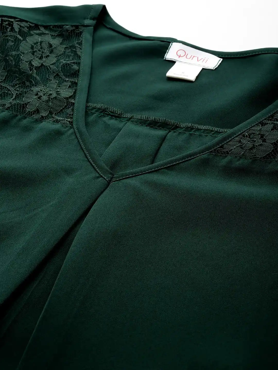 Emerald green crepe top with floral net sleeves and yoke