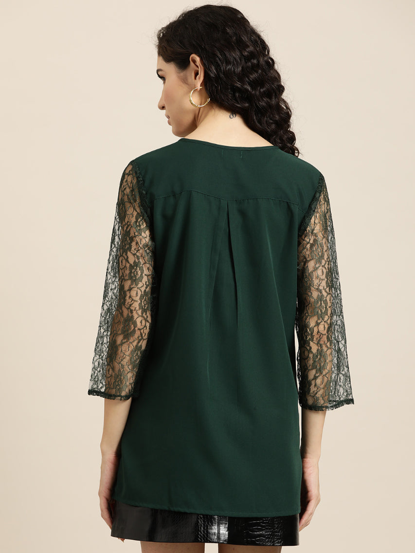 Emerald green crepe top with floral net sleeves and yoke