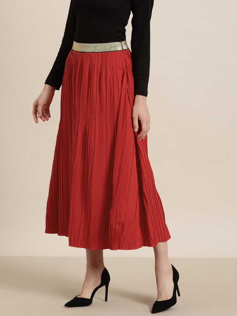 Red long pleated party skirt with a glittery elastic waistband