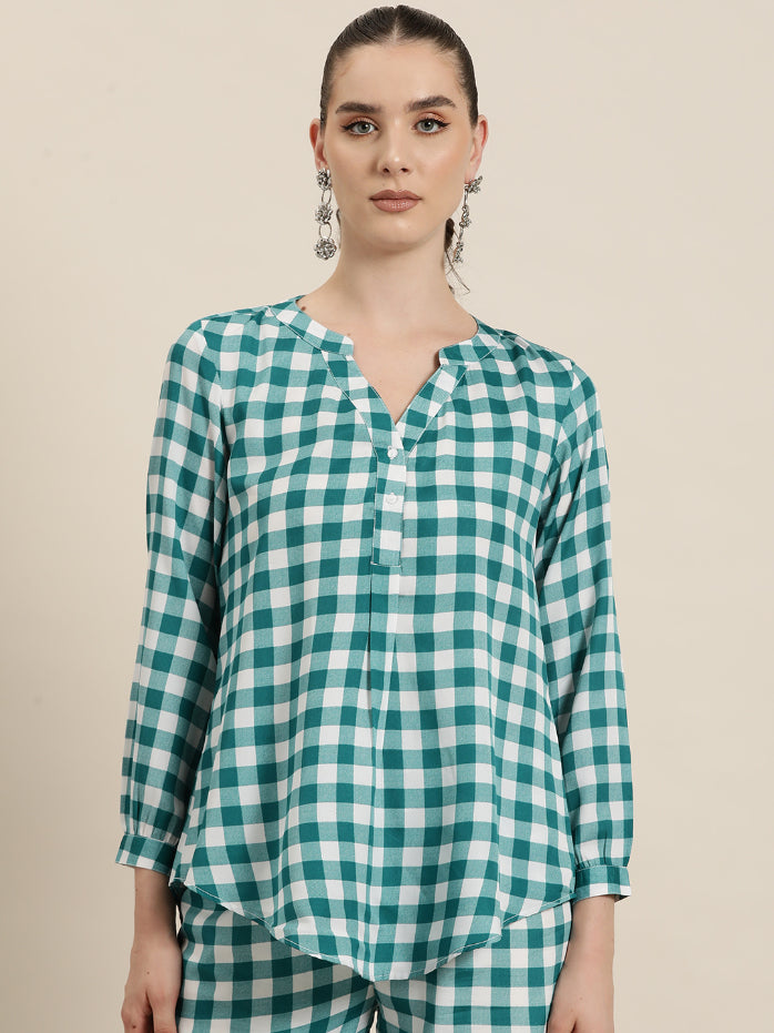 Teal and White plaid half placket shirt with full cuff sleeves.