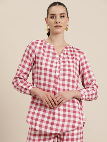 Pink and White plaid half placket shirt with full cuff sleeves.