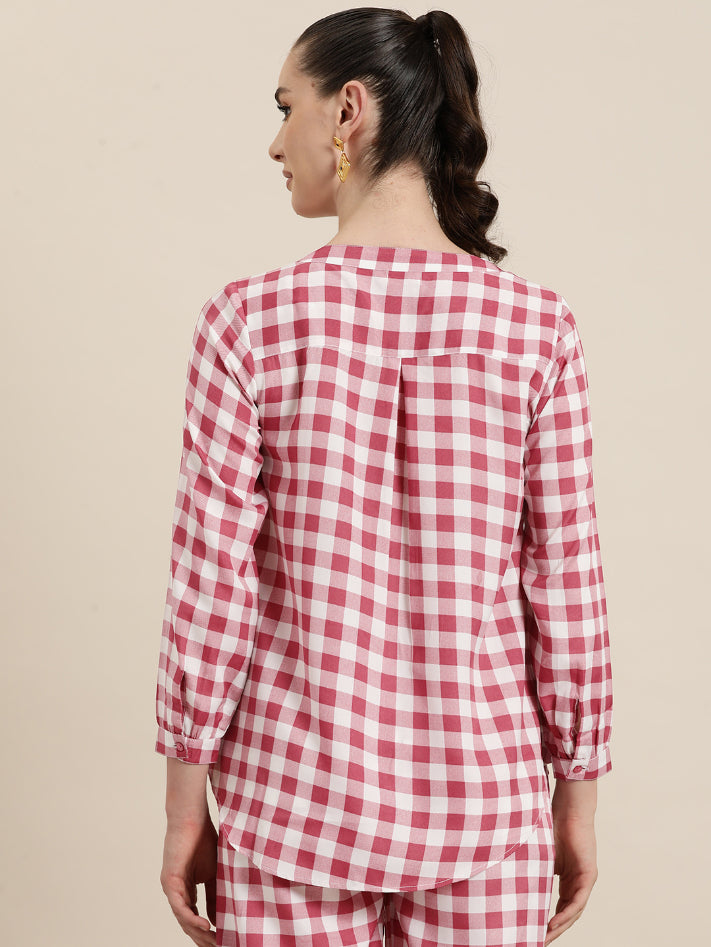 Pink and White plaid half placket shirt with full cuff sleeves.