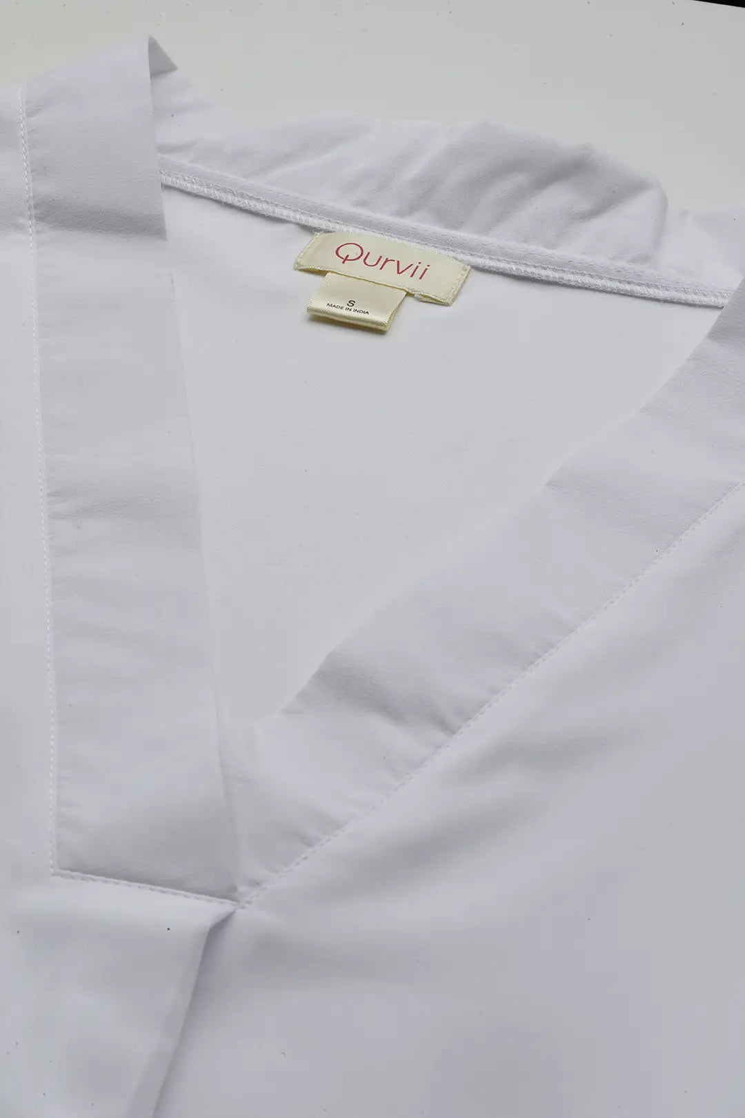 White V-neck Full cuff sleeve top.