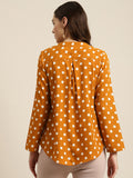 rust polka crepe shirt — close-up detail
