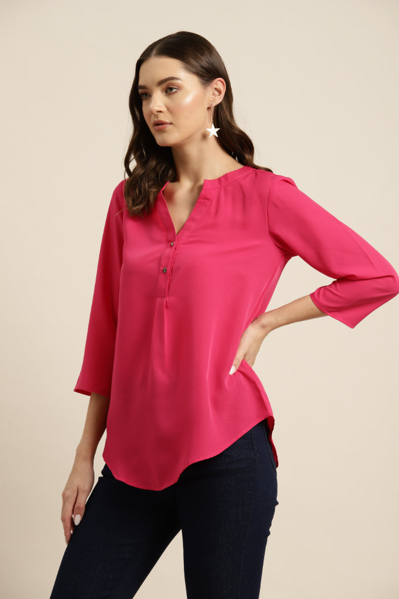 Hot pink crepe half placket shirt.