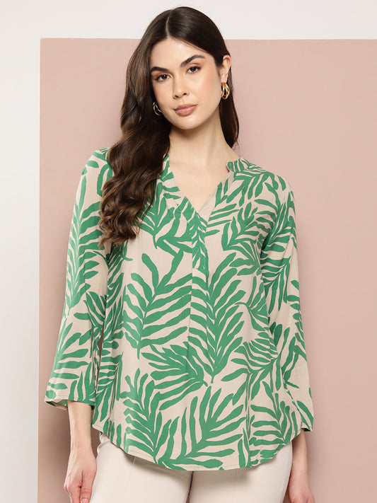 Green shirt with tropical print, featuring a half placket, mandarin collar, and regular sleeve