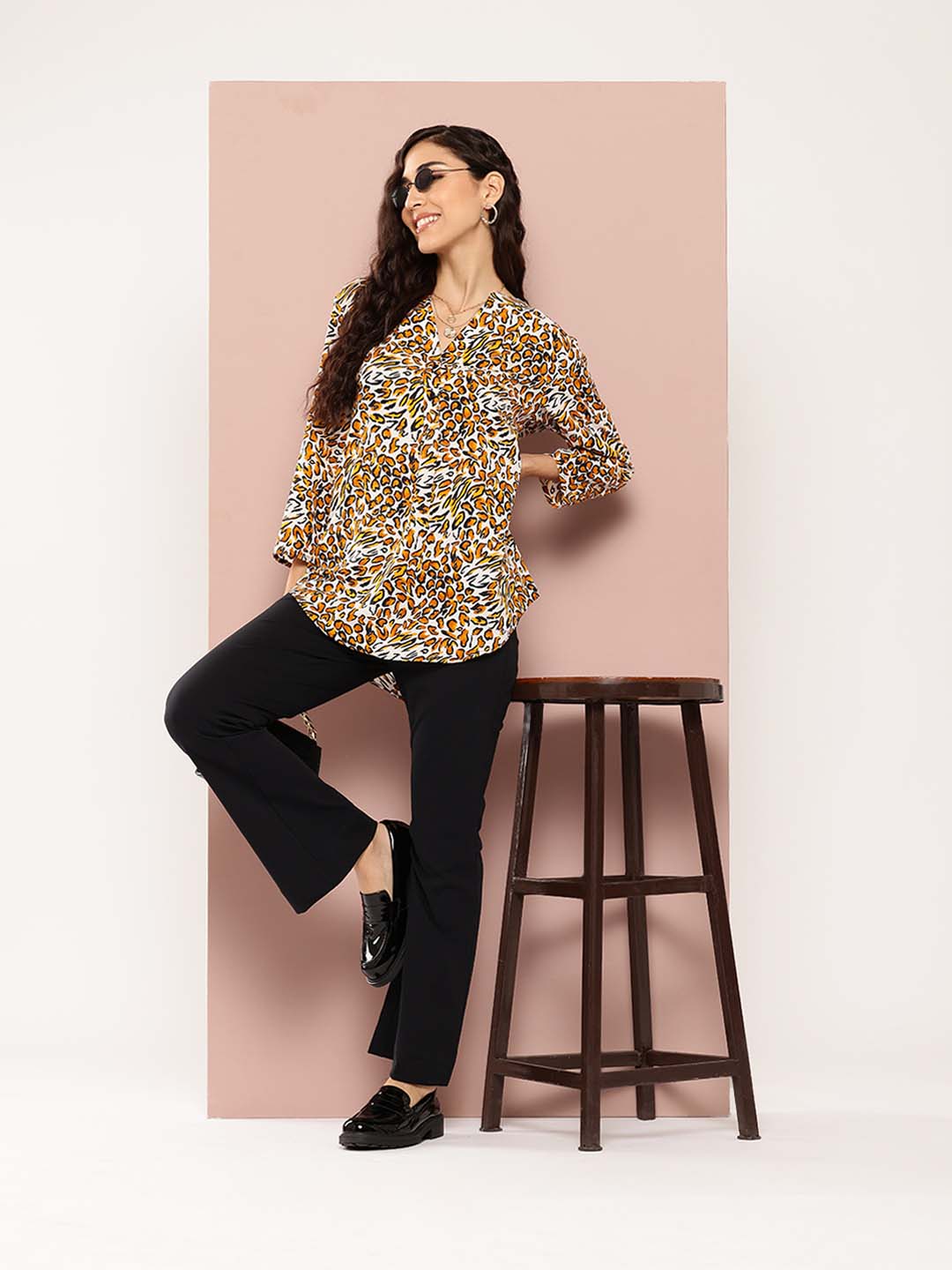 Black and white leopard print shirt half placket and mandarin collar.