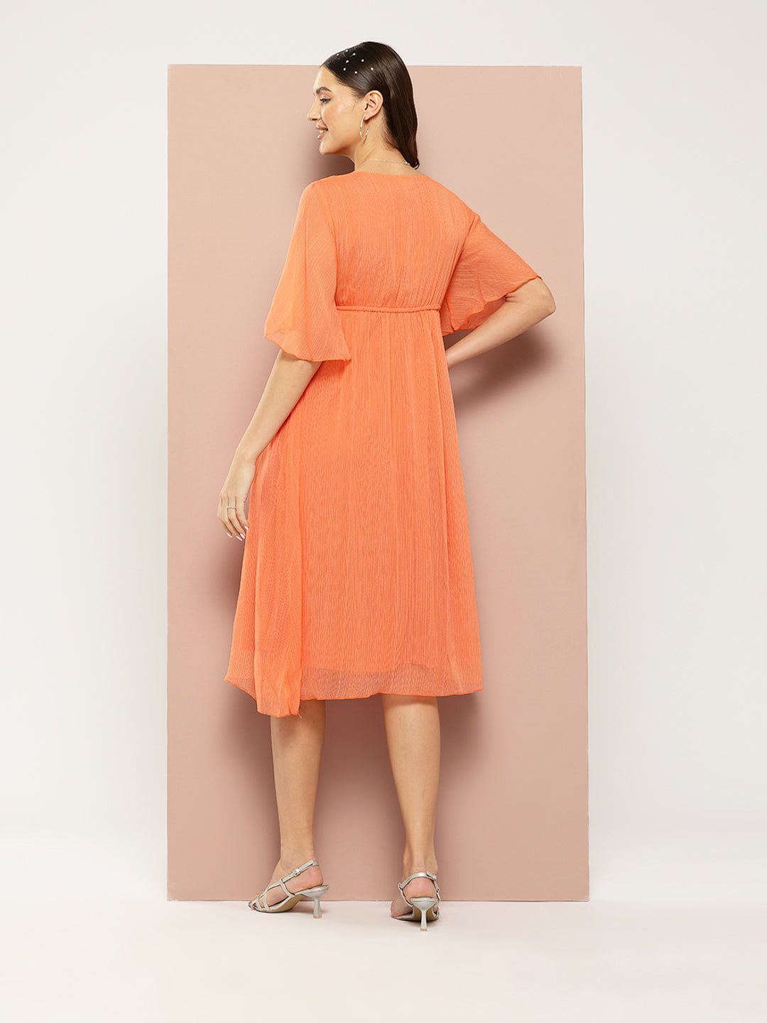 Orange georgette fit and flared party dress with sequins embelishment