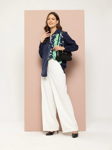 Navy and green floral colorblock shirt.