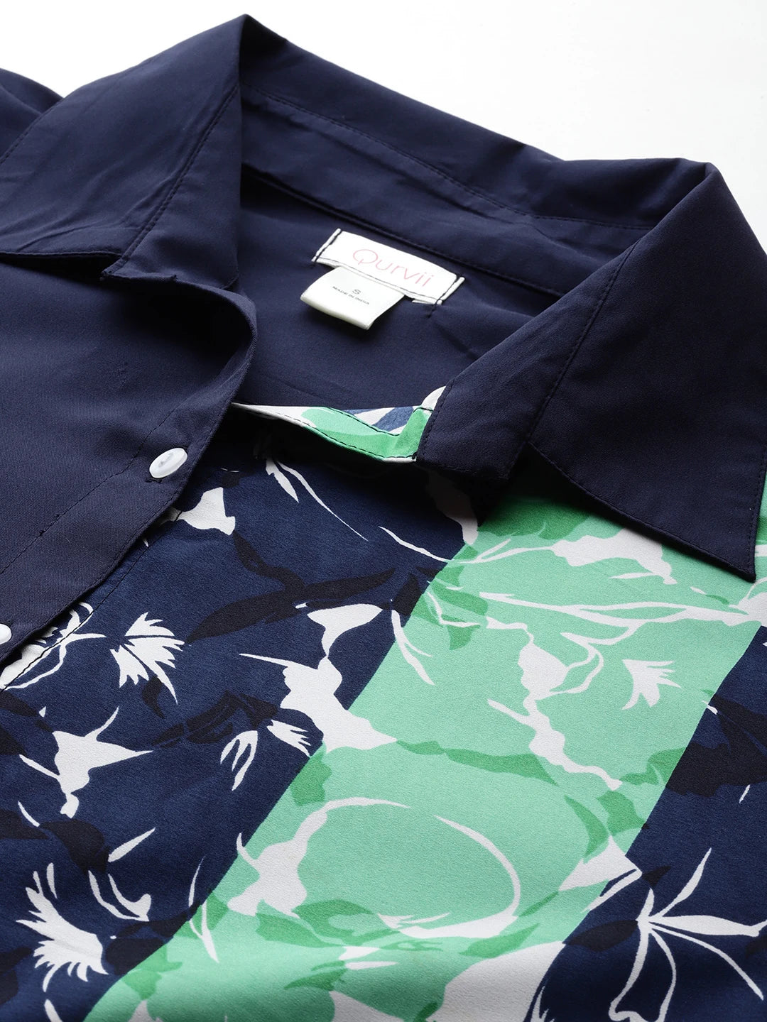 Navy and green floral colorblock shirt.