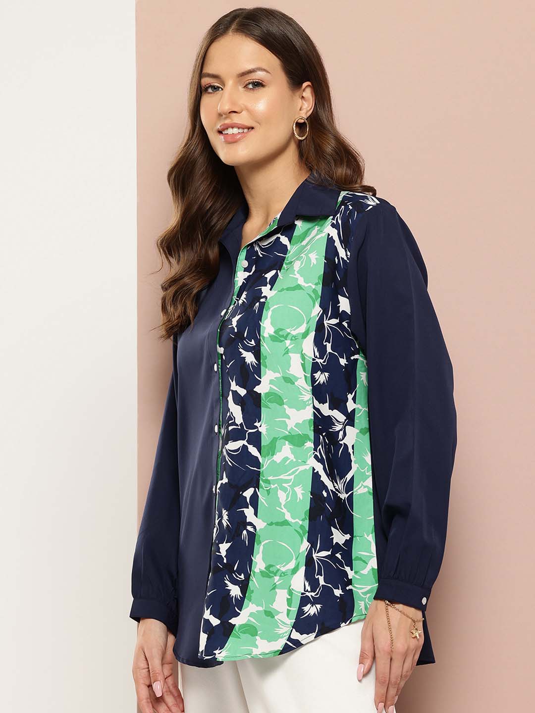 Navy and green floral colorblock shirt.