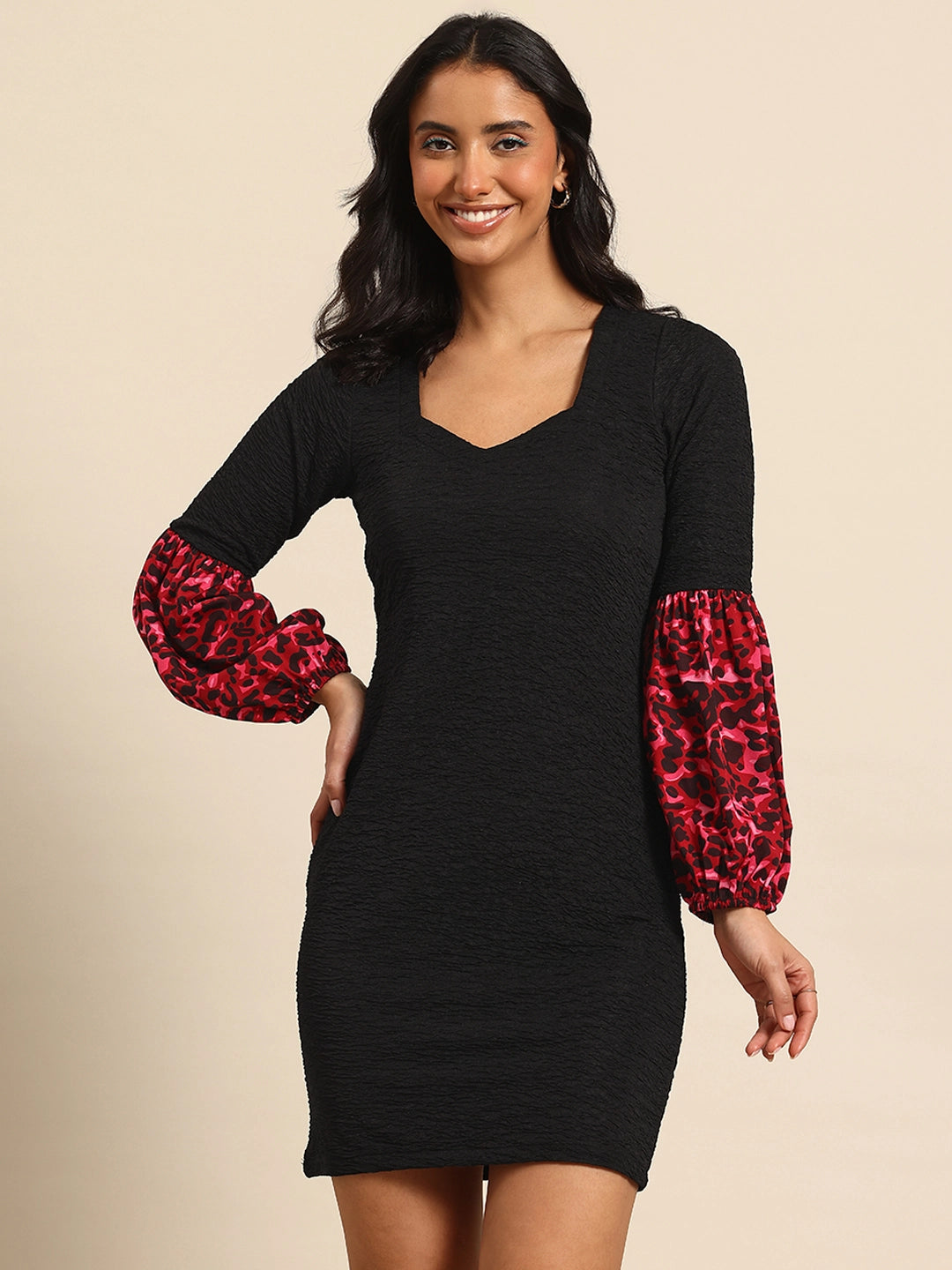 Black bodycon dress with lantern sleeves