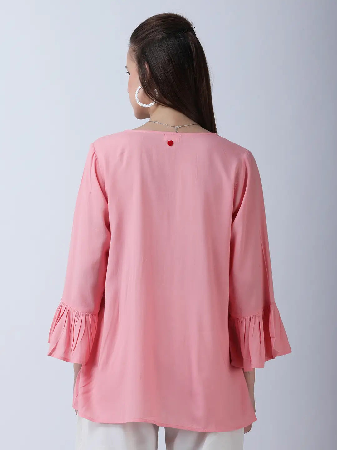 Peplum rayon top with printed neckline