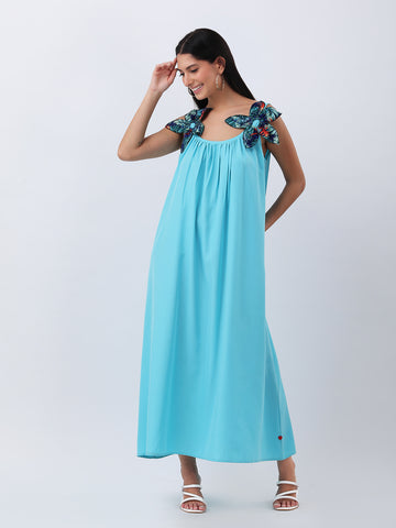 Turquoise maxi dress with statement flower bow
