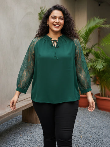 Green tie-up neck top with sheer lace sleeves