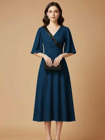 Teal party dress with sequins embelishment