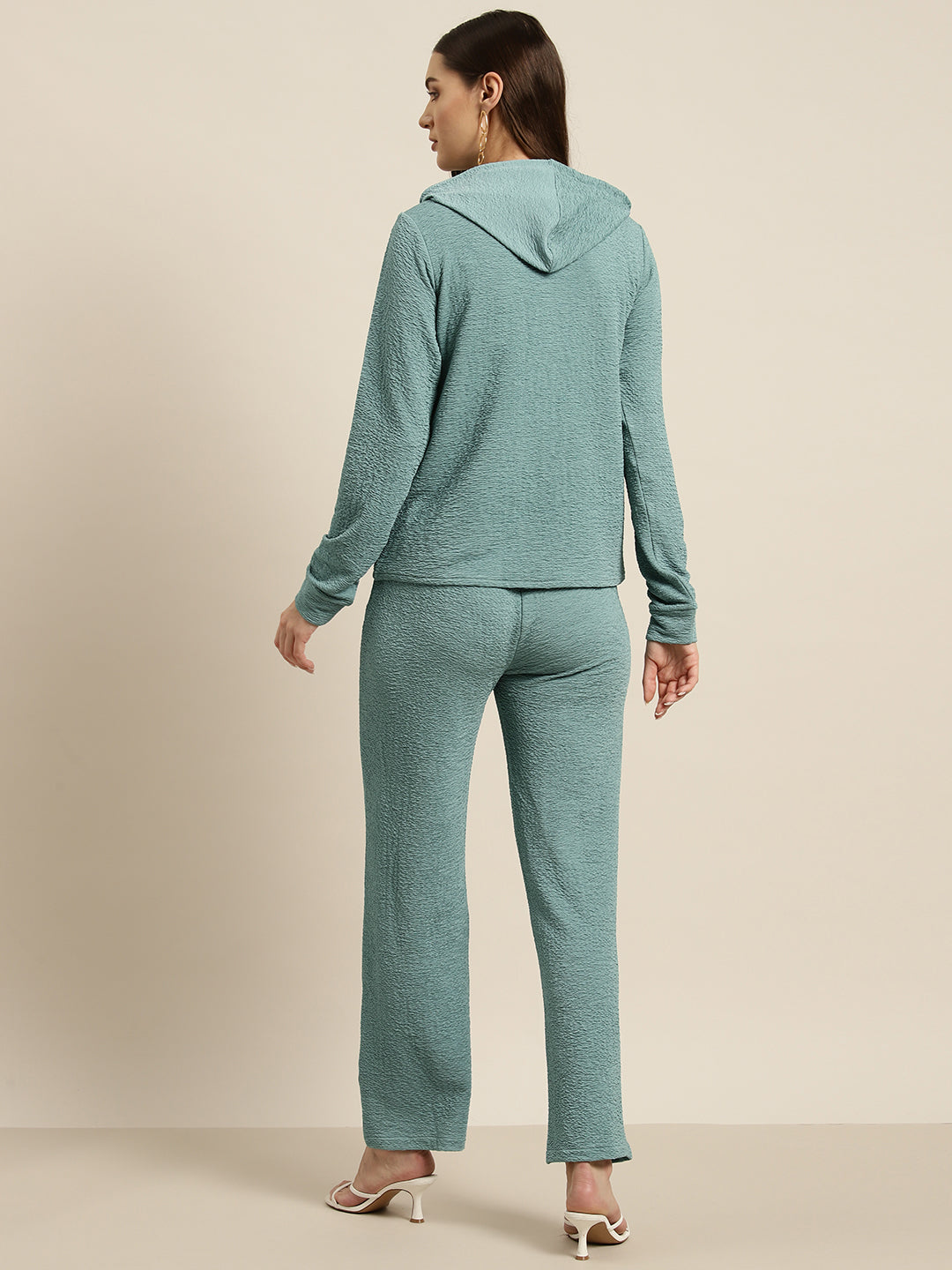 Sea green full slevees hoodie with a gold zipper and pant set.