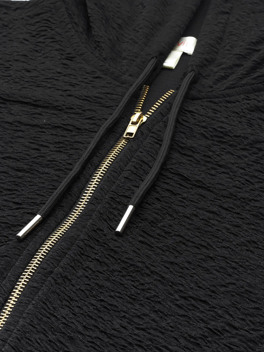 Black full slevees hoodie with a gold zipper and pant set.