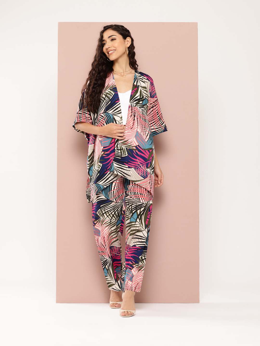 Multi colour tropical print shrug and pant co-ord sets.