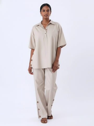 Solid polpin half placket shirt and pant with button detailing in side seam