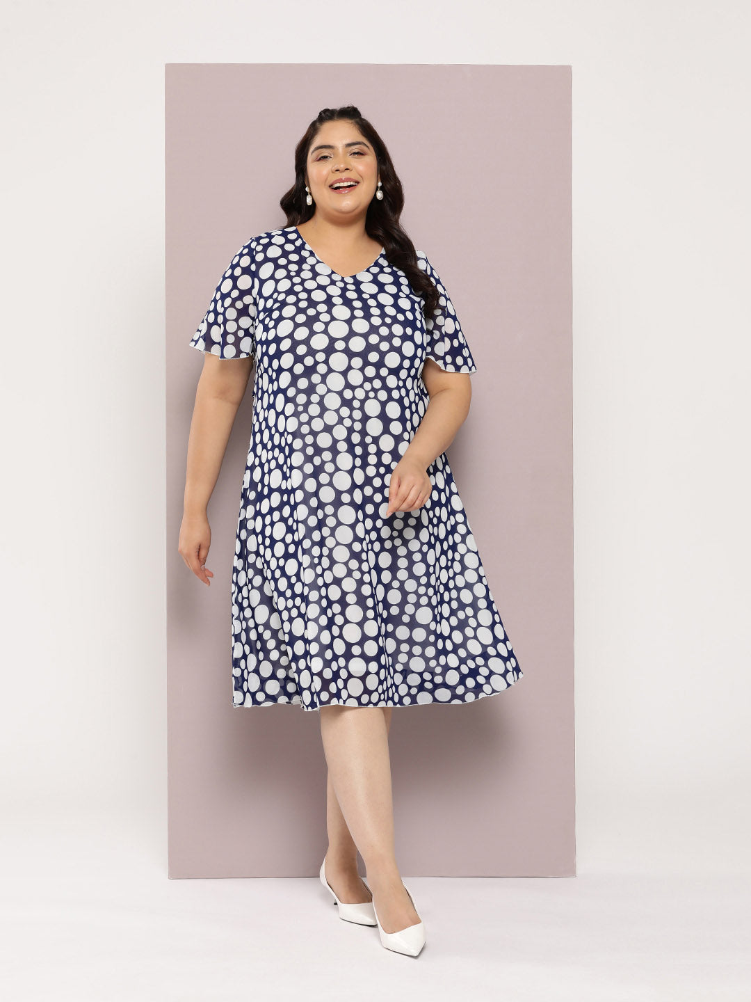 Navy polka georgette A-line dress with V-neck and bell sleeves