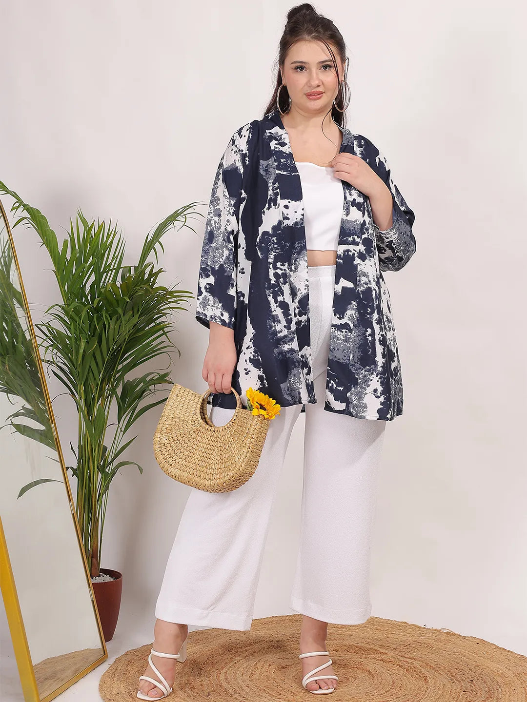 Navy and white print shrug features 3/4 regular sleeves